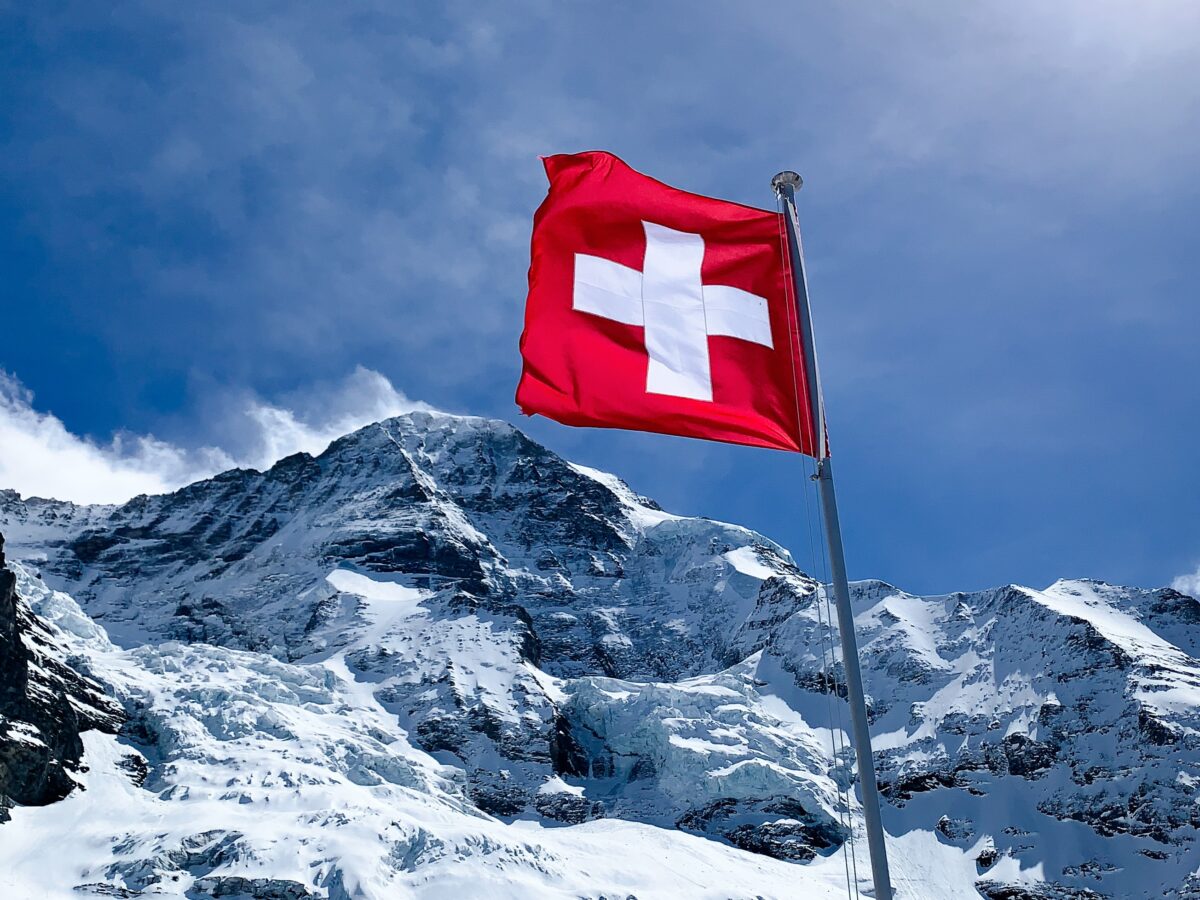 Switzerland flag may be on a sticker of the american car shipped to Europe.